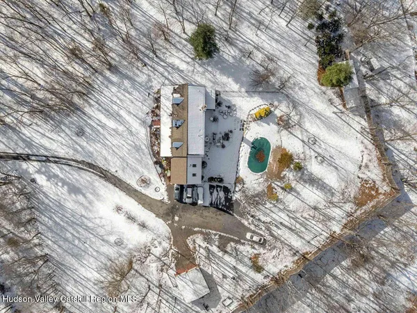 a bathroom with a sink mirror and painting on the wall