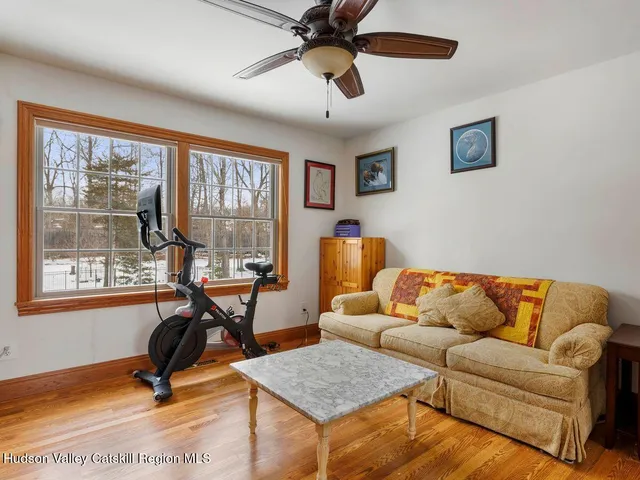 a bedroom with furniture and a window