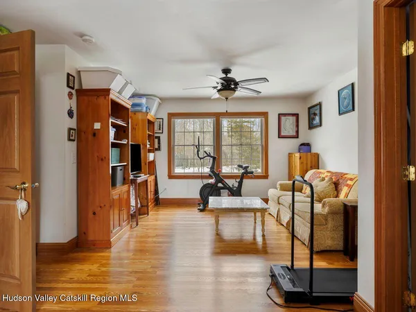 a living room with furniture a table and chairs