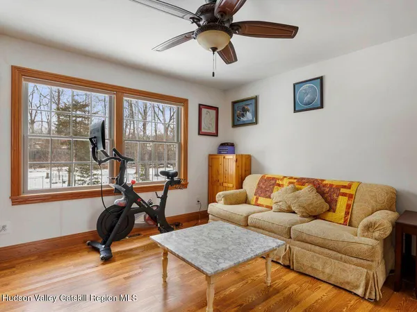 a bedroom with furniture and a window