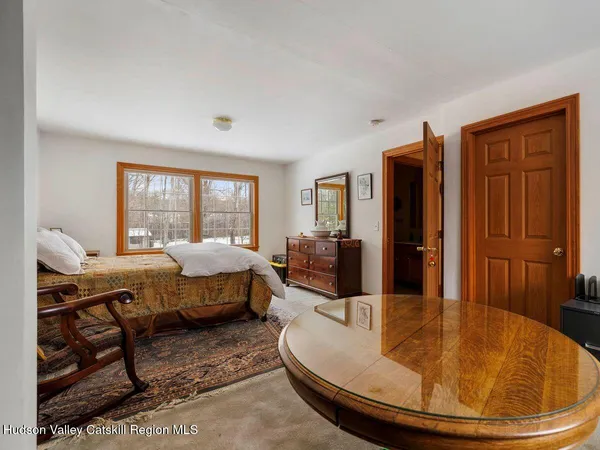 a view of a house with a yard covered in snow