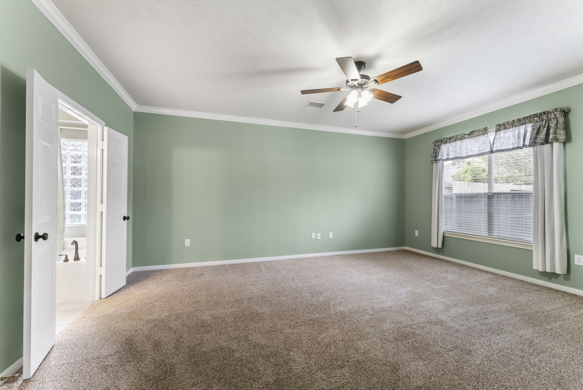 11 South Bendrook Loop Conroe, TX 77384 - Photo 12 of 27 a view of an empty room with a window