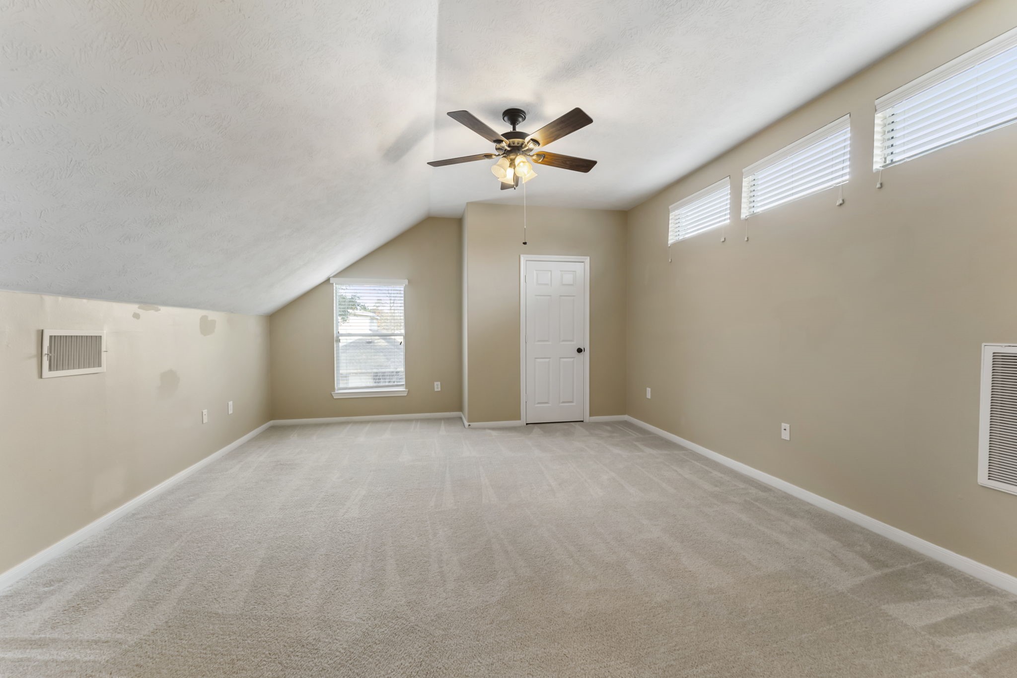 11 South Bendrook Loop Conroe, TX 77384 - Photo 18 of 27 a view of an empty room with a window