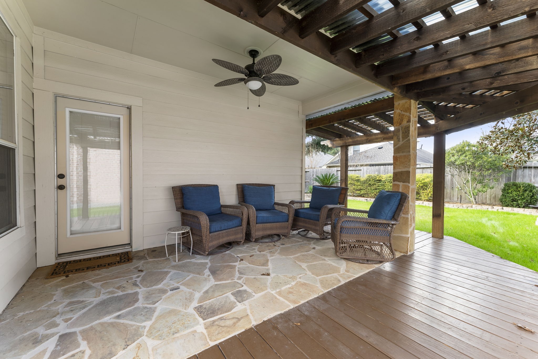 11 South Bendrook Loop Conroe, TX 77384 - Photo 21 of 27 a outdoor space with patio the couch and wooden floor