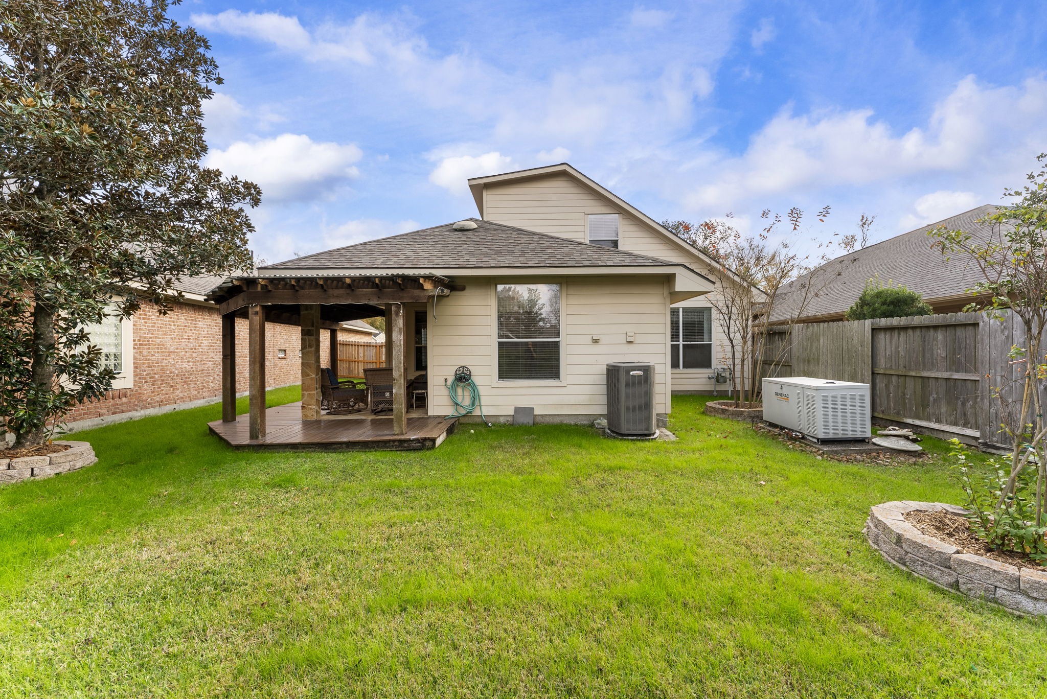 11 South Bendrook Loop Conroe, TX 77384 - Photo 25 of 27 a front view of a house with garden