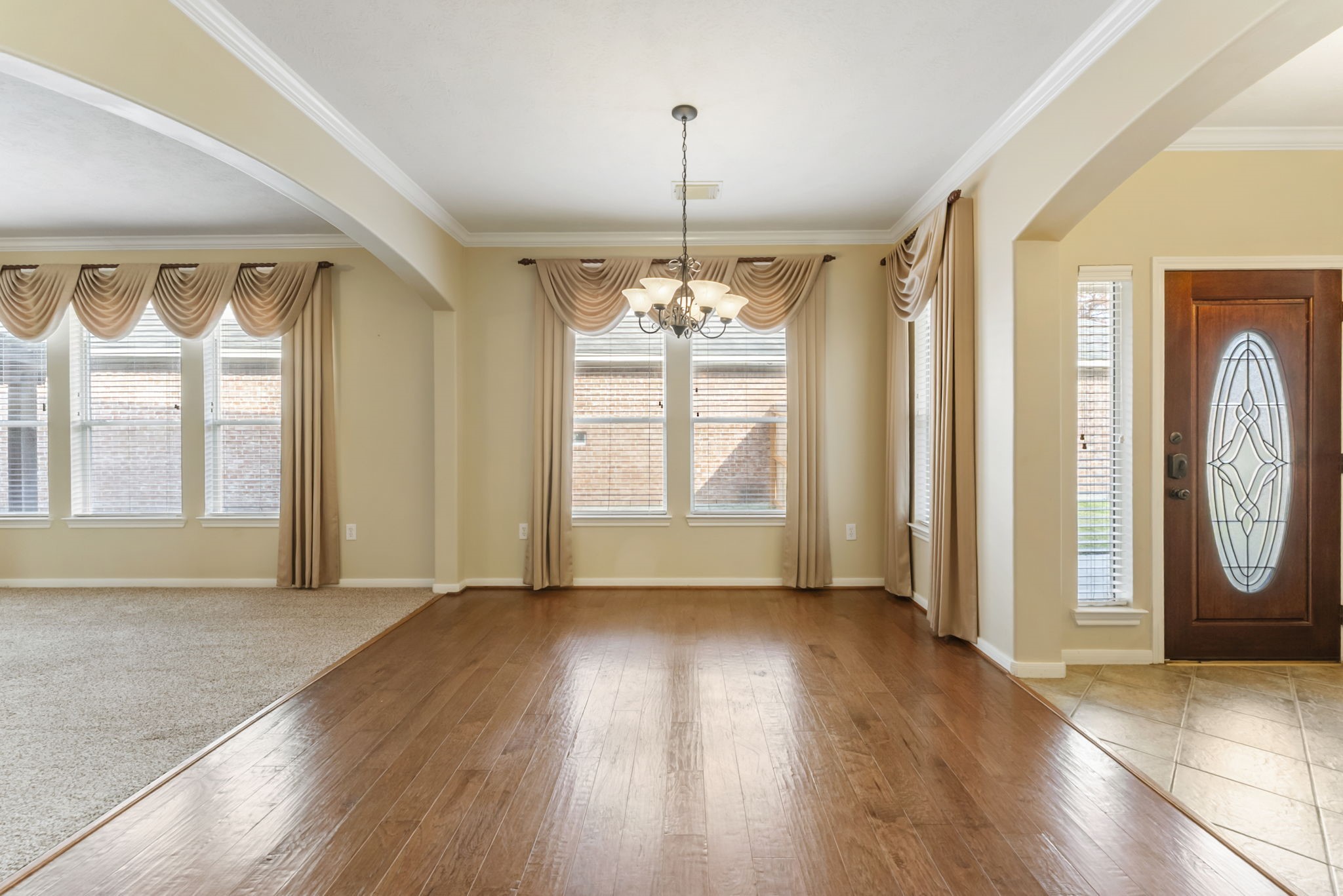 11 South Bendrook Loop Conroe, TX 77384 - Photo 9 of 27 a view of an empty room with wooden floor and a window