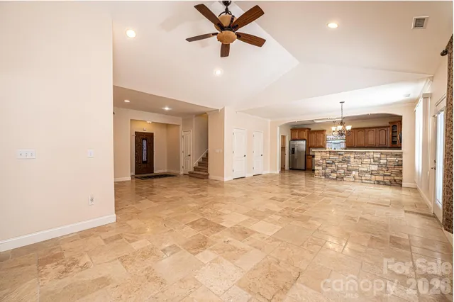 a view of a livingroom with a kitchen