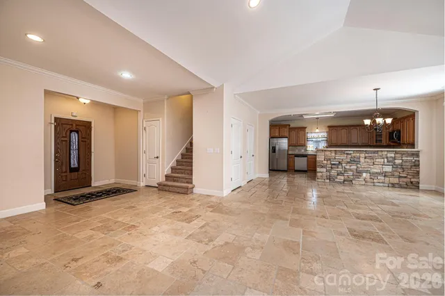 a view of an empty room with a fireplace
