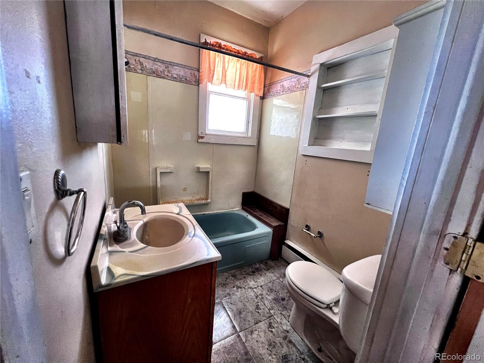 125 Seventh Street Hugo, CO 80821 - Photo 12 of 24 a bathroom with a sink vanity and toilet