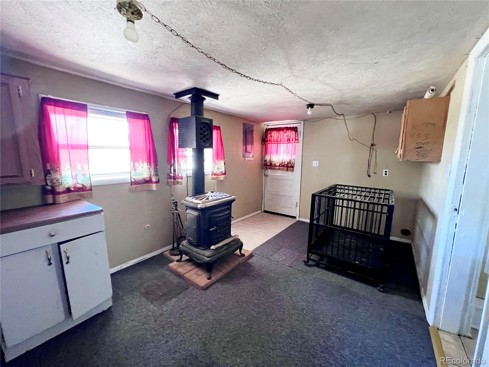 125 Seventh Street Hugo, CO 80821 - Photo 18 of 24 a room with furniture and window