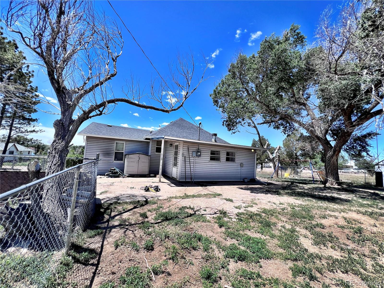 125 Seventh Street Hugo, CO 80821 - Photo 24 of 24 a front view of a house with a yard