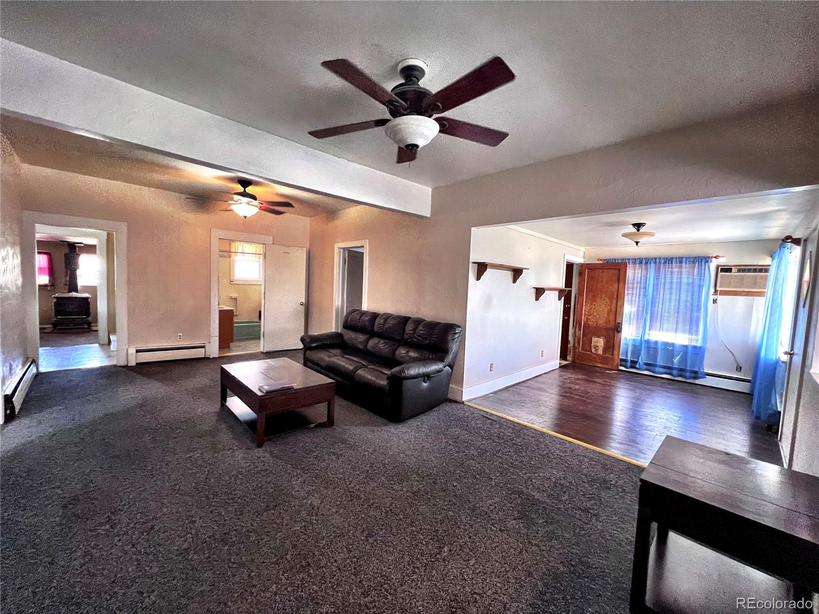 125 Seventh Street Hugo, CO 80821 - Photo 4 of 24 a living room with furniture and kitchen view