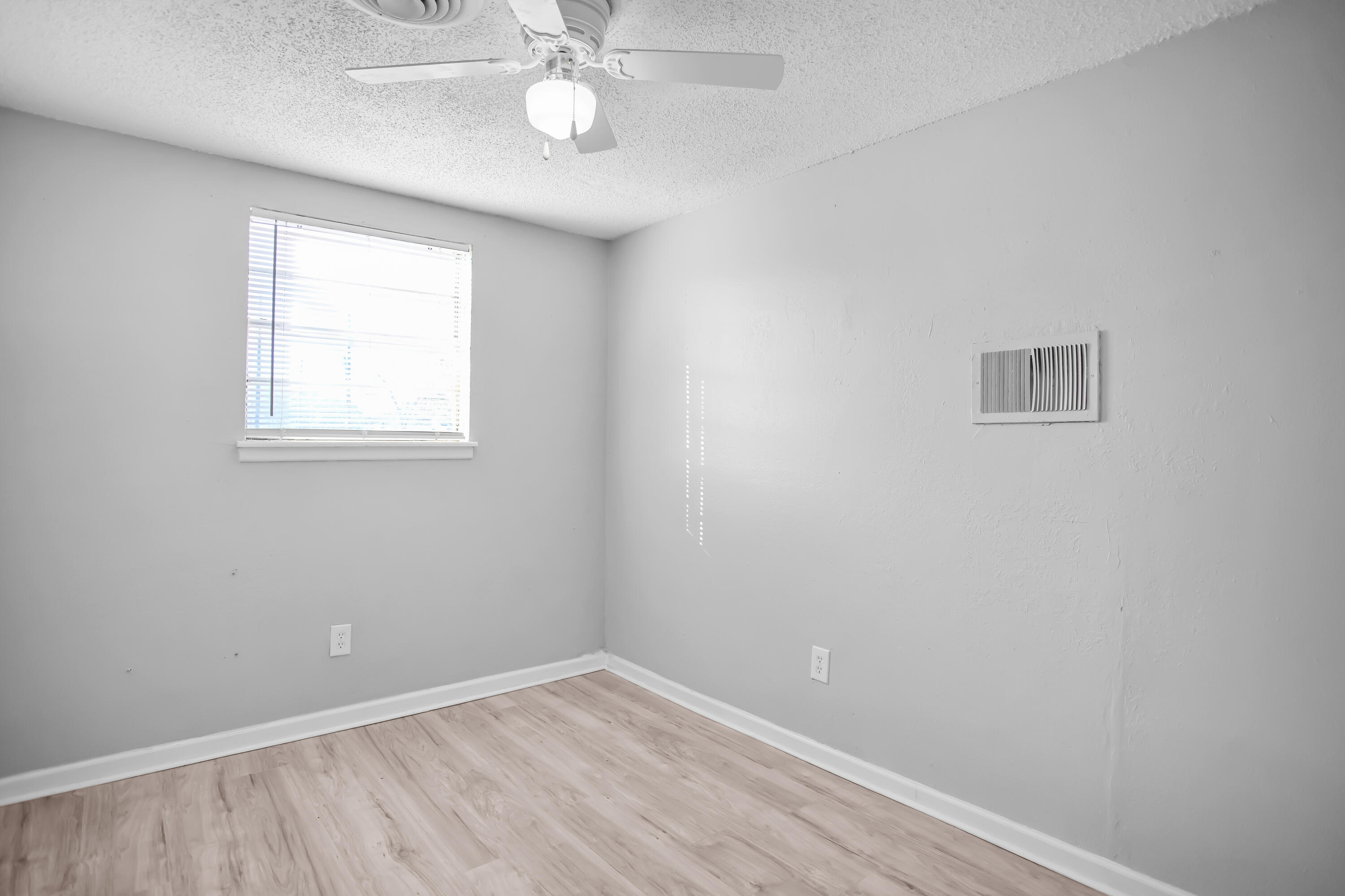 2430 31st Street Lubbock, TX 79411 - Photo 17 of 46 an empty room with a window