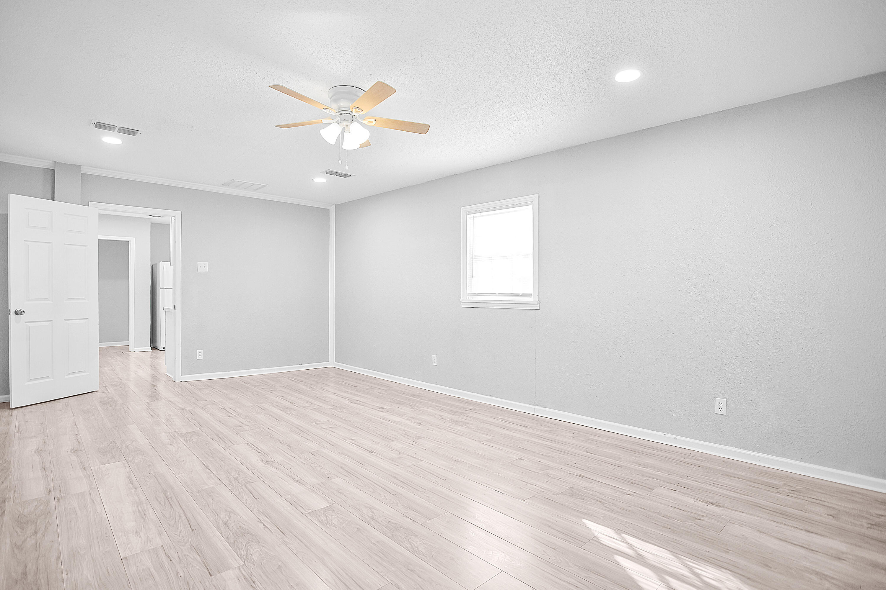 2430 31st Street Lubbock, TX 79411 - Photo 22 of 46 wooden floor in an empty room with a window