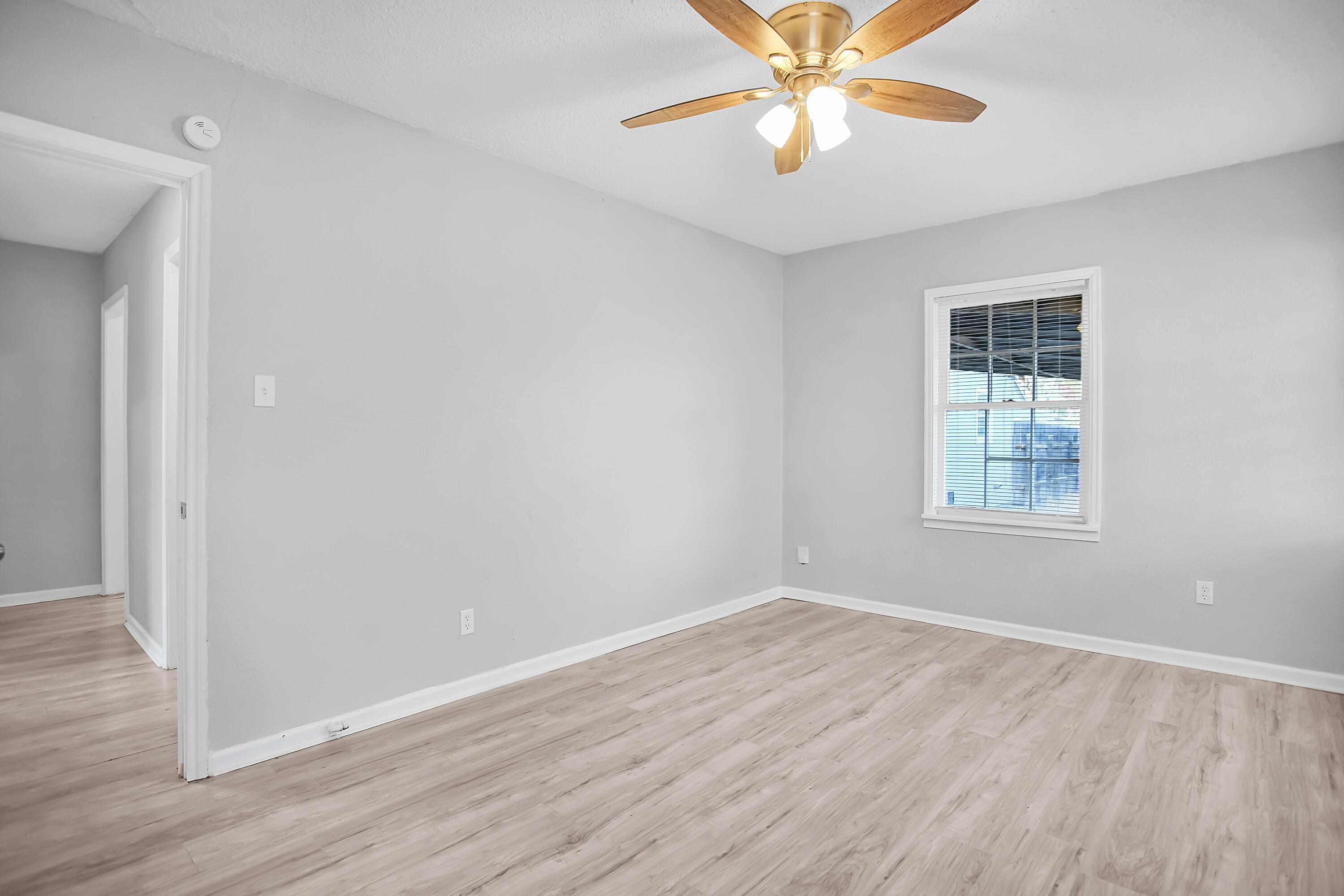 2430 31st Street Lubbock, TX 79411 - Photo 27 of 46 wooden floor in an empty room with a window