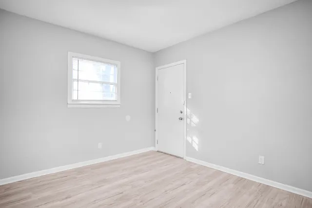 a kitchen with stainless steel appliances granite countertop a sink stove and white cabinets