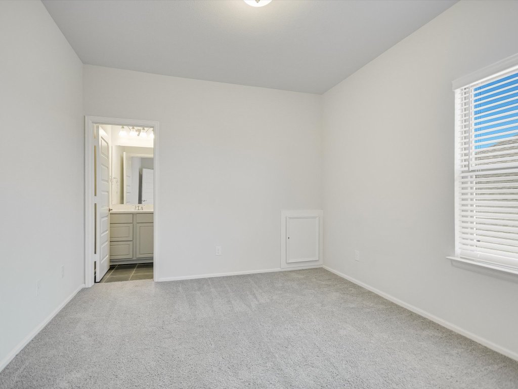 396 Cold Riv Run Kyle, TX 78640 - Photo 13 of 20 an empty room with a empty space and windows