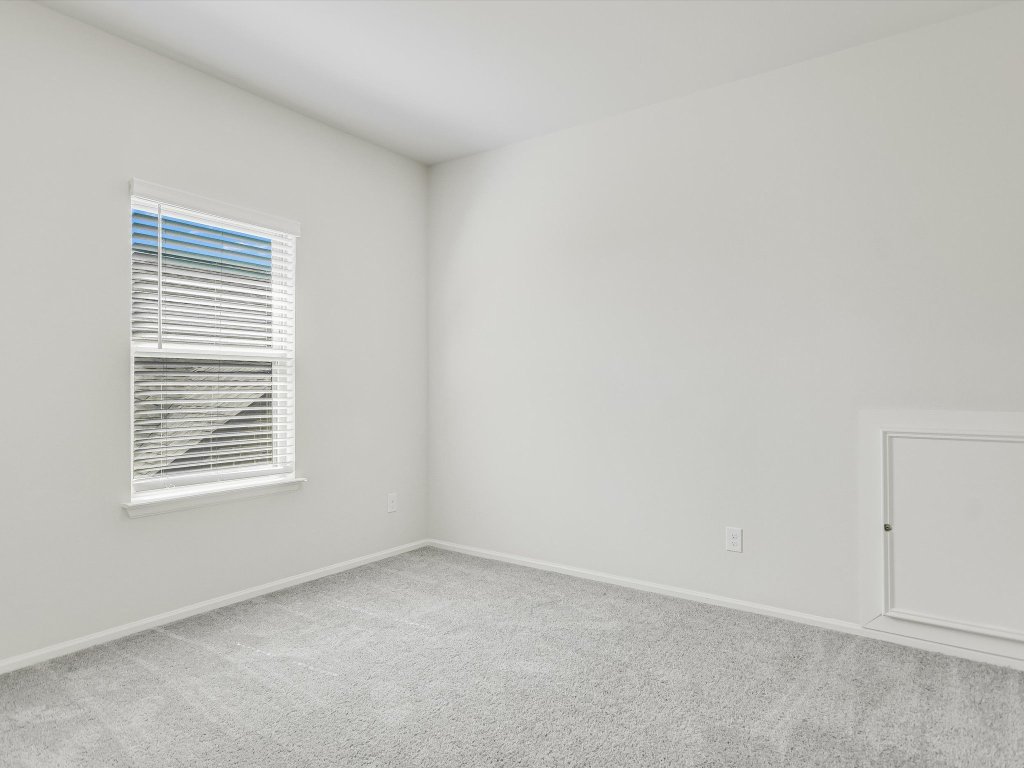 396 Cold Riv Run Kyle, TX 78640 - Photo 17 of 20 an empty room with a window