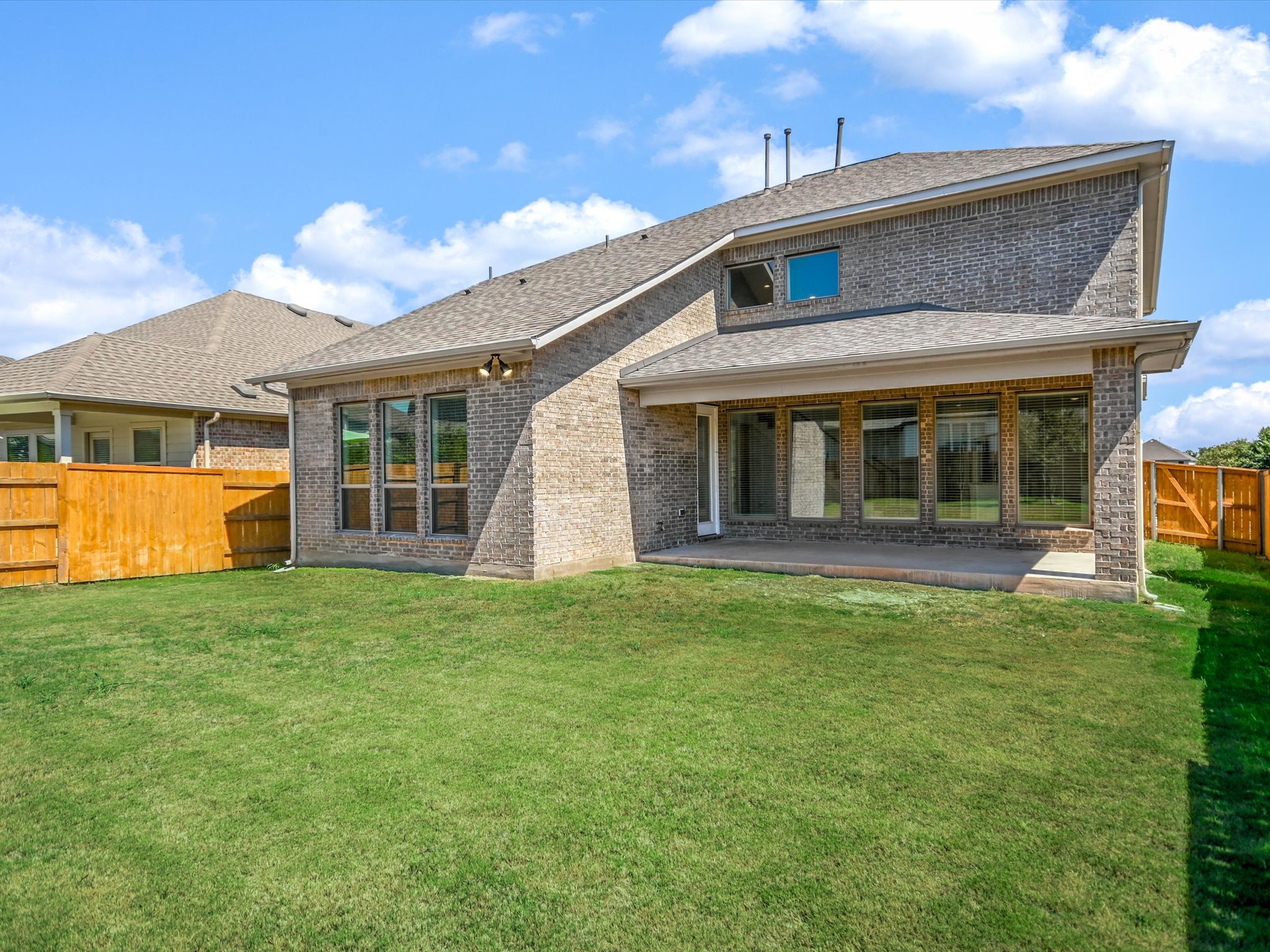 396 Cold Riv Run Kyle, TX 78640 - Photo 19 of 20 a front view of a house with a garden