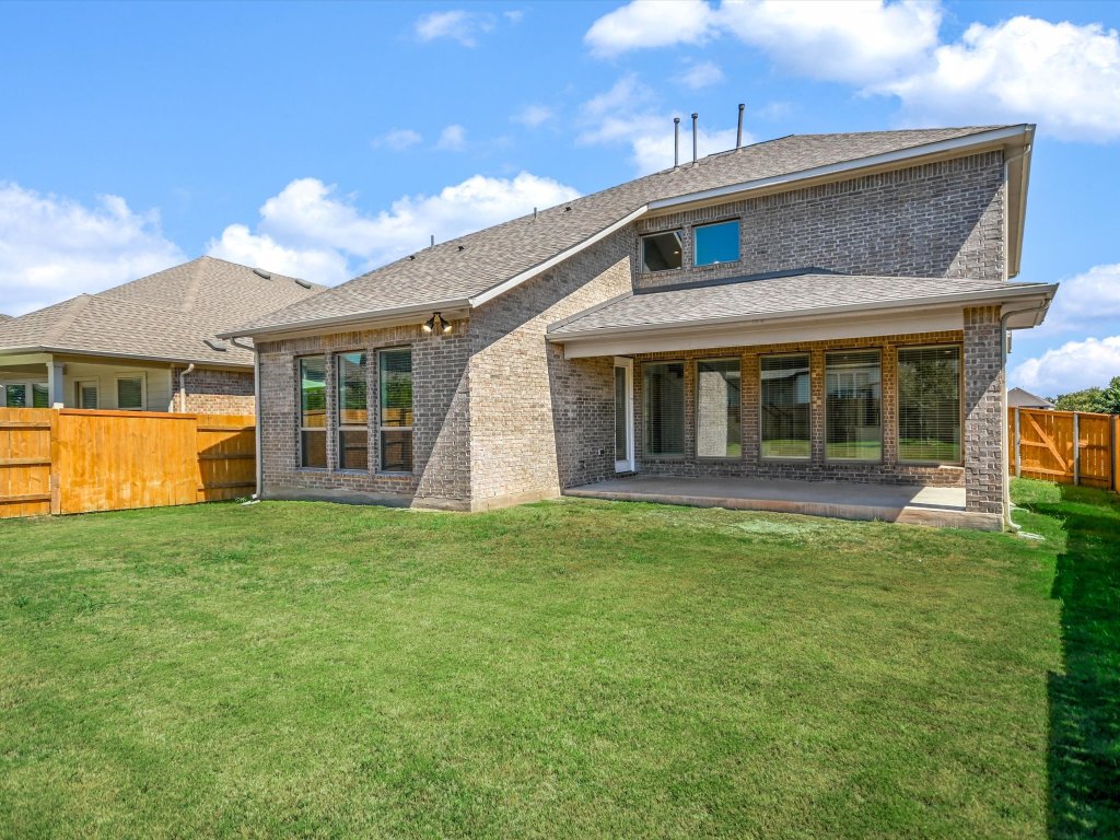 396 Cold Riv Run Kyle, TX 78640 - Photo 19 of 20 a front view of a house with a garden