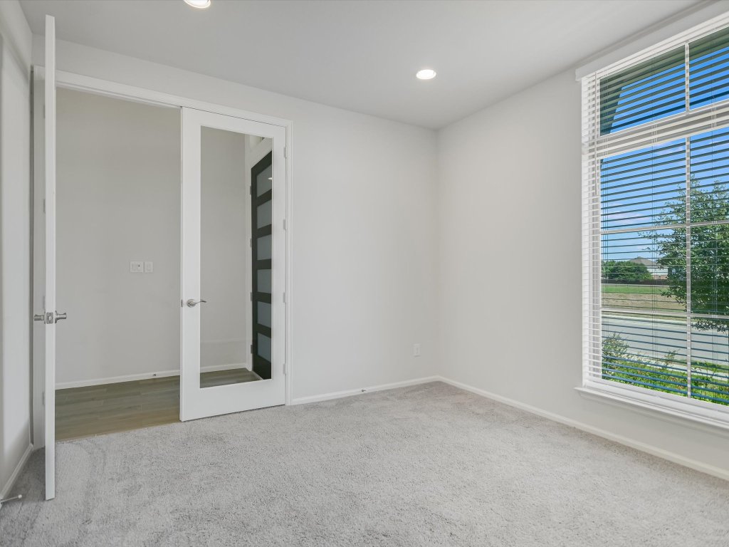 396 Cold Riv Run Kyle, TX 78640 - Photo 4 of 20 an empty room with windows