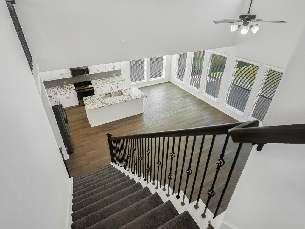 396 Cold Riv Run Kyle, TX 78640 - Photo 9 of 20 a view of entryway with furniture and wooden floor