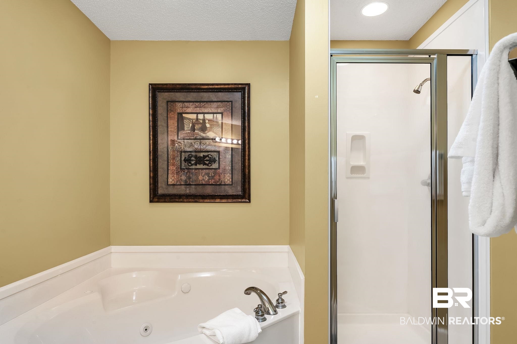 27580 Canal Road, Unit 1214 AND BOAT SLIP #62 Orange Beach, AL 36561 - Photo 32 of 67 Full bath featuring a stall shower and a tub with jets