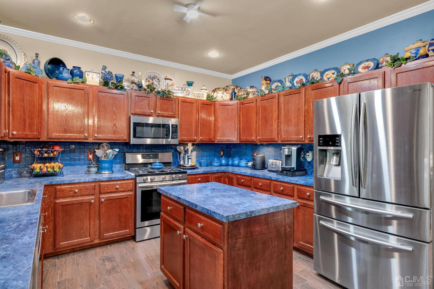 1416 Princess Avenue Brick, NJ 08724 - Photo 18 of 39 a kitchen with stainless steel appliances granite countertop a refrigerator a sink and a stove