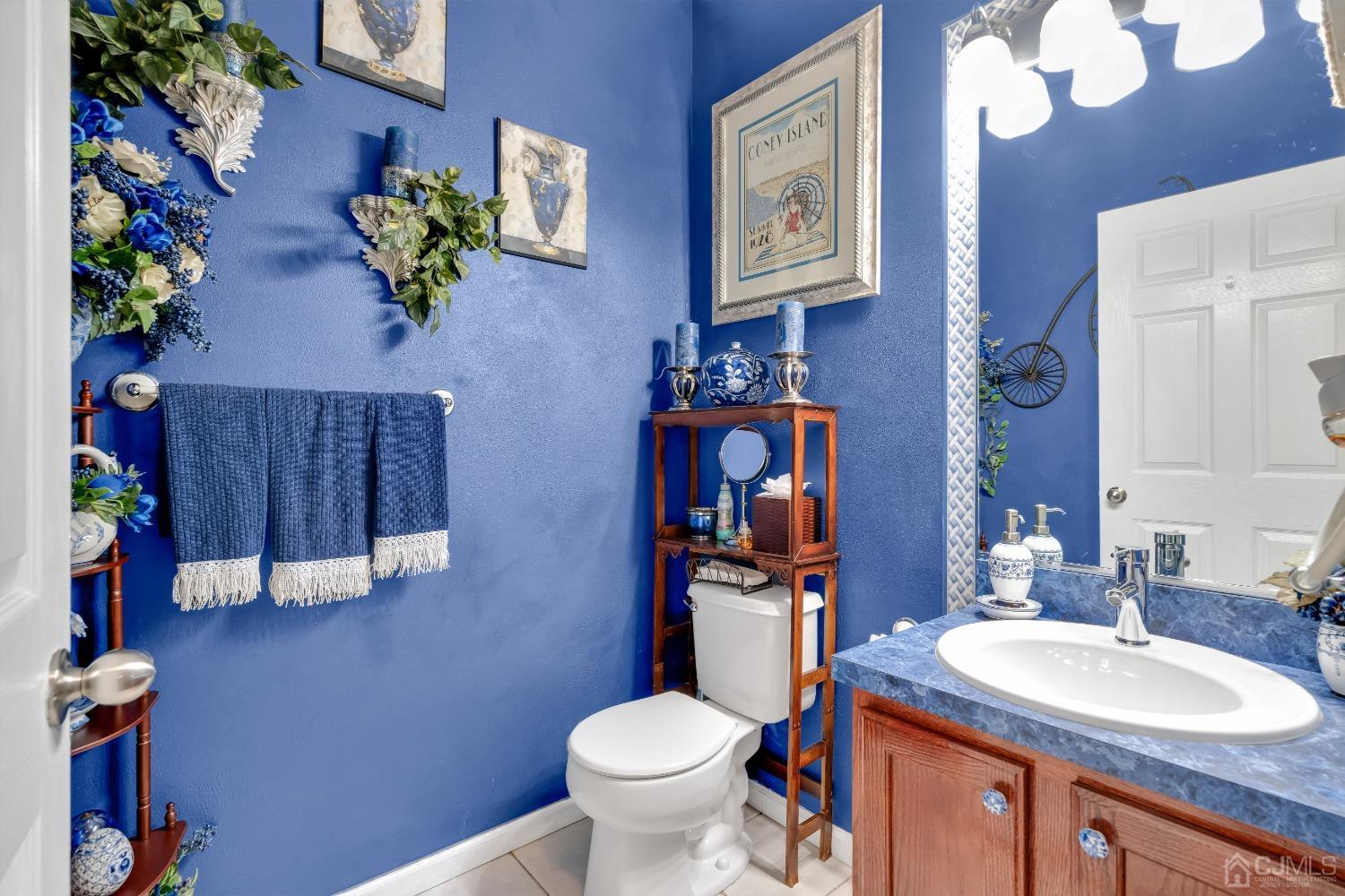 1416 Princess Avenue Brick, NJ 08724 - Photo 19 of 39 a bathroom with a toilet sink and mirror
