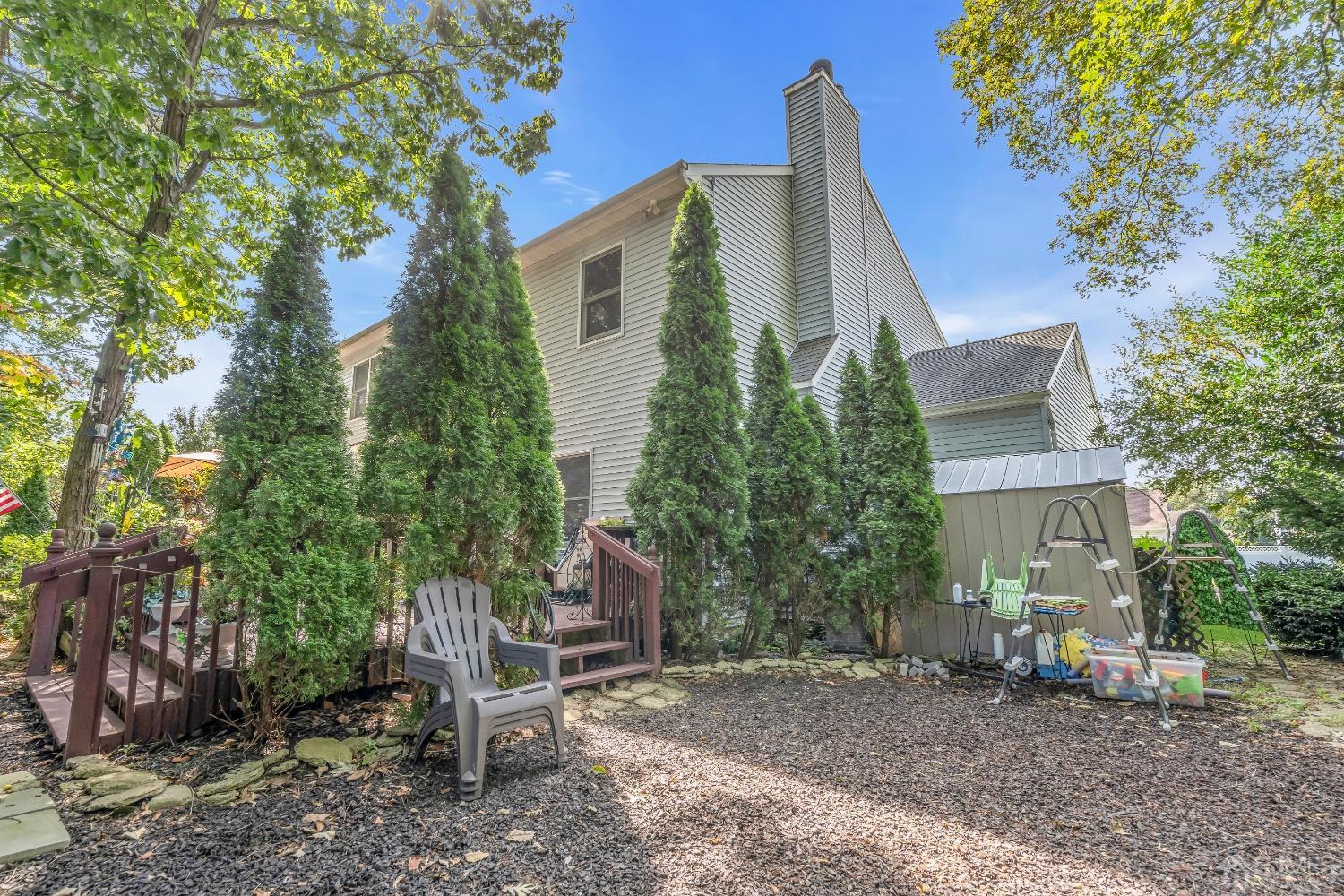 1416 Princess Avenue Brick, NJ 08724 - Photo 37 of 39 a view of a house with a yard and tree s