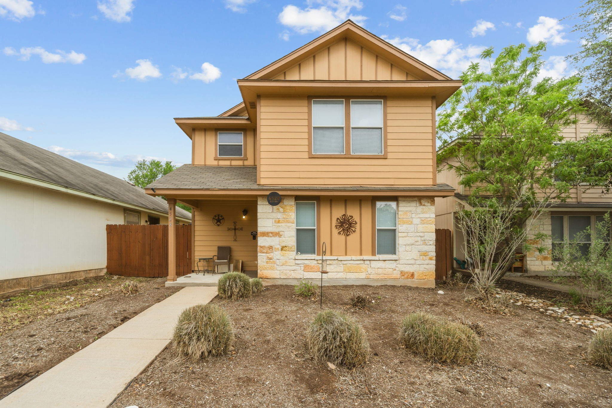 4528 Best Way Austin, TX 78725 - Photo 1 of 40 View of front of home featuring board and batten siding, stone siding, and roof with shingles