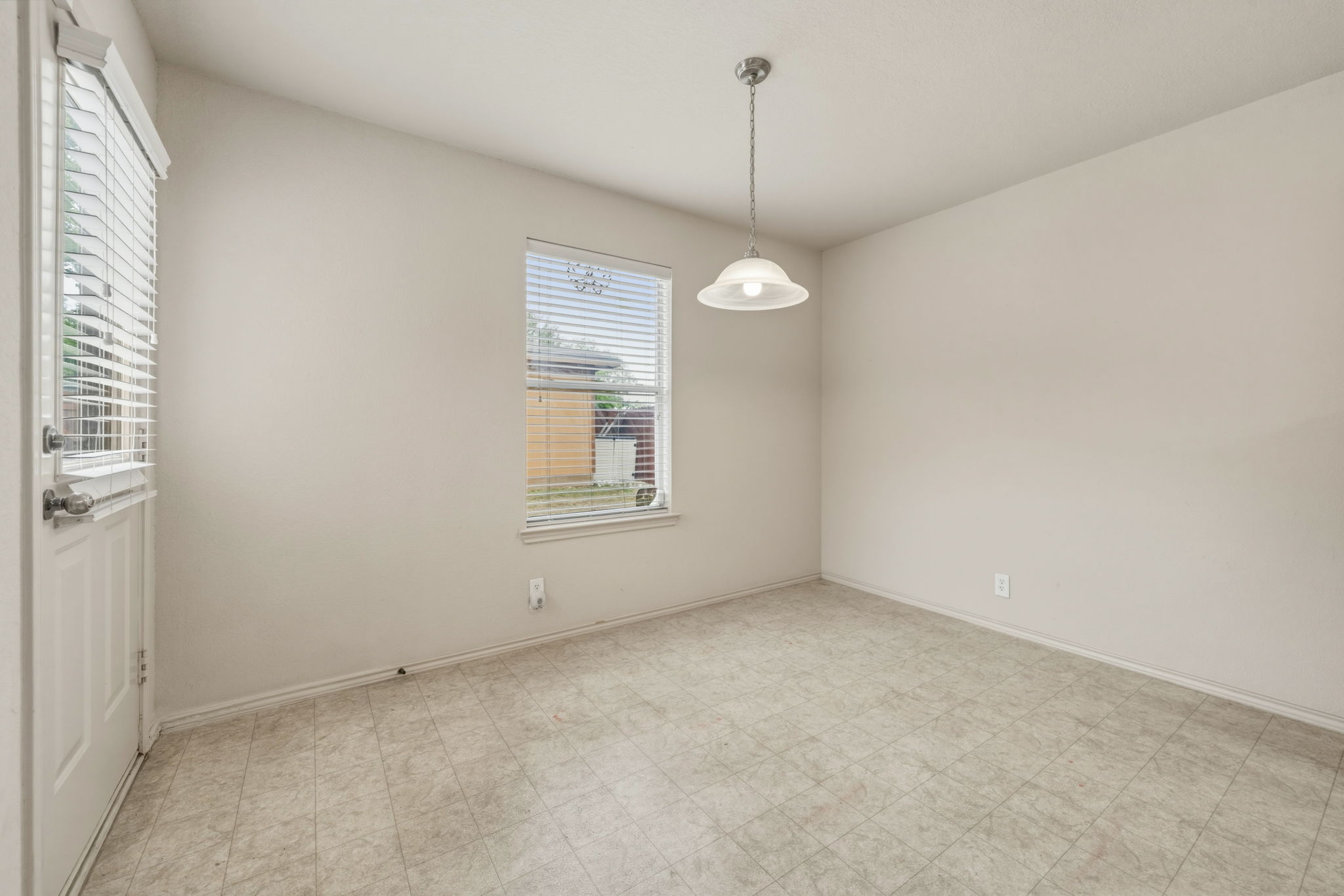 4528 Best Way Austin, TX 78725 - Photo 12 of 40 Empty room featuring baseboards and light flooring