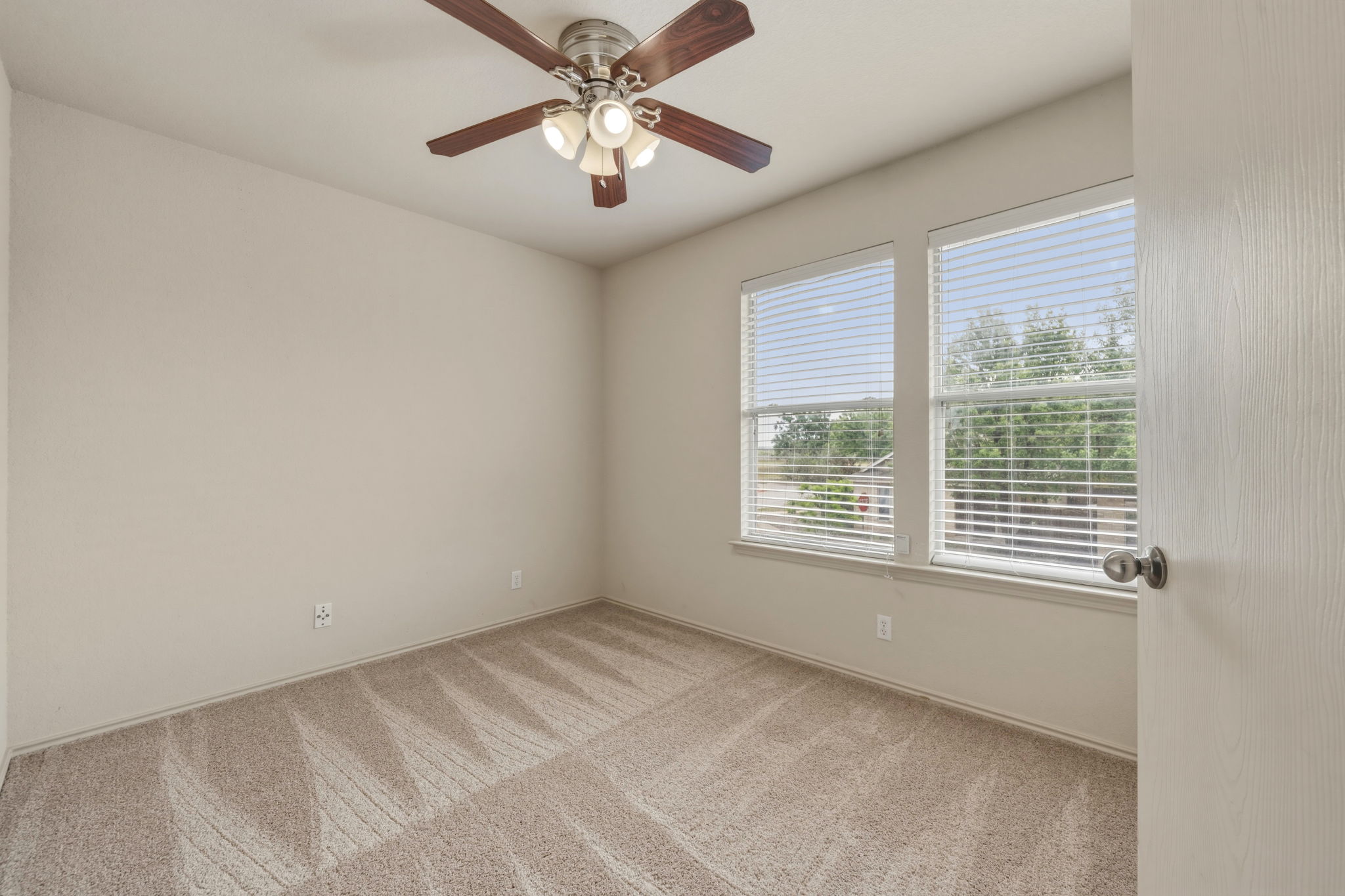 4528 Best Way Austin, TX 78725 - Photo 19 of 40 Unfurnished room featuring light colored carpet and ceiling fan