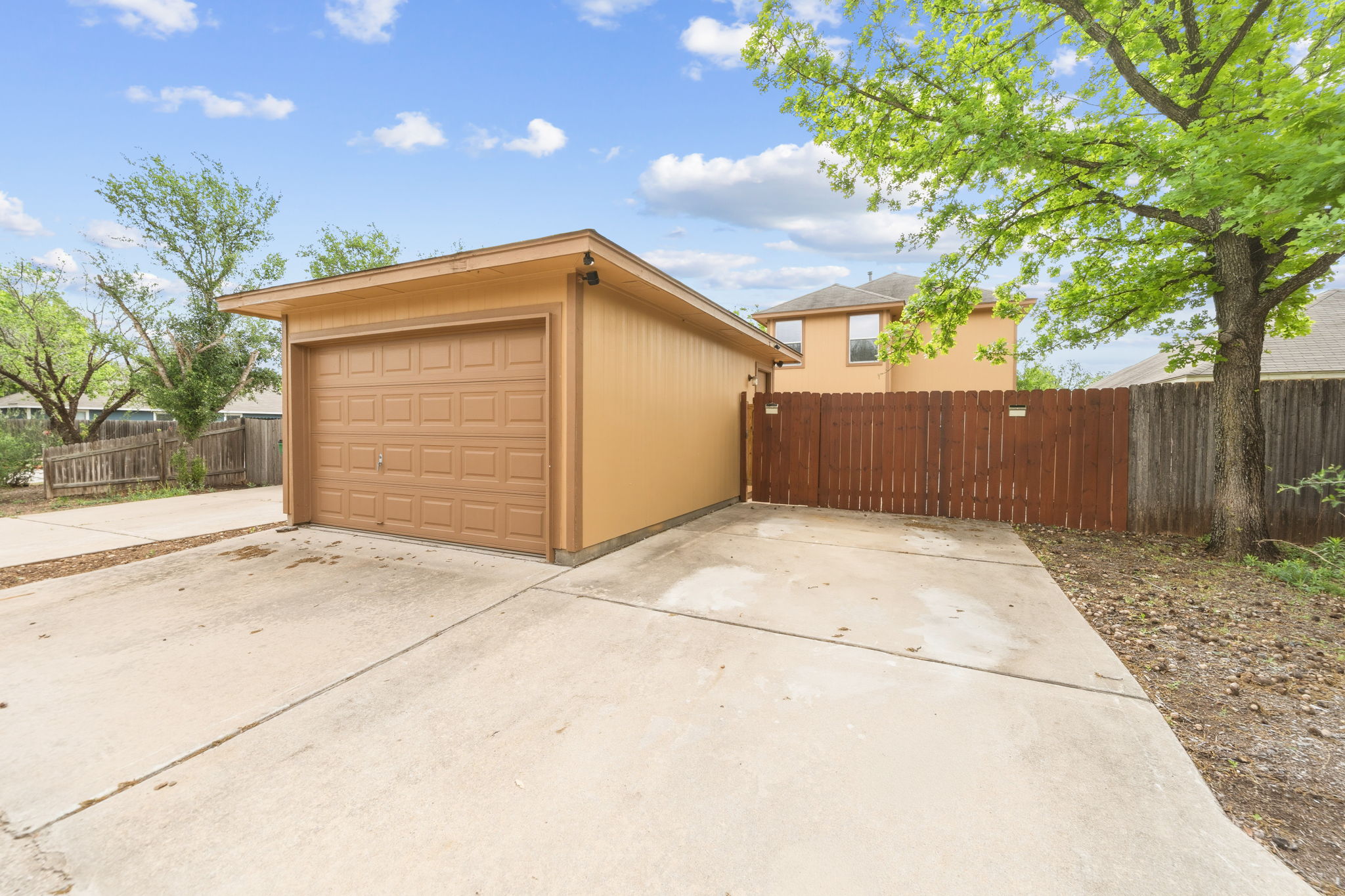 4528 Best Way Austin, TX 78725 - Photo 2 of 40 Detached garage featuring concrete driveway