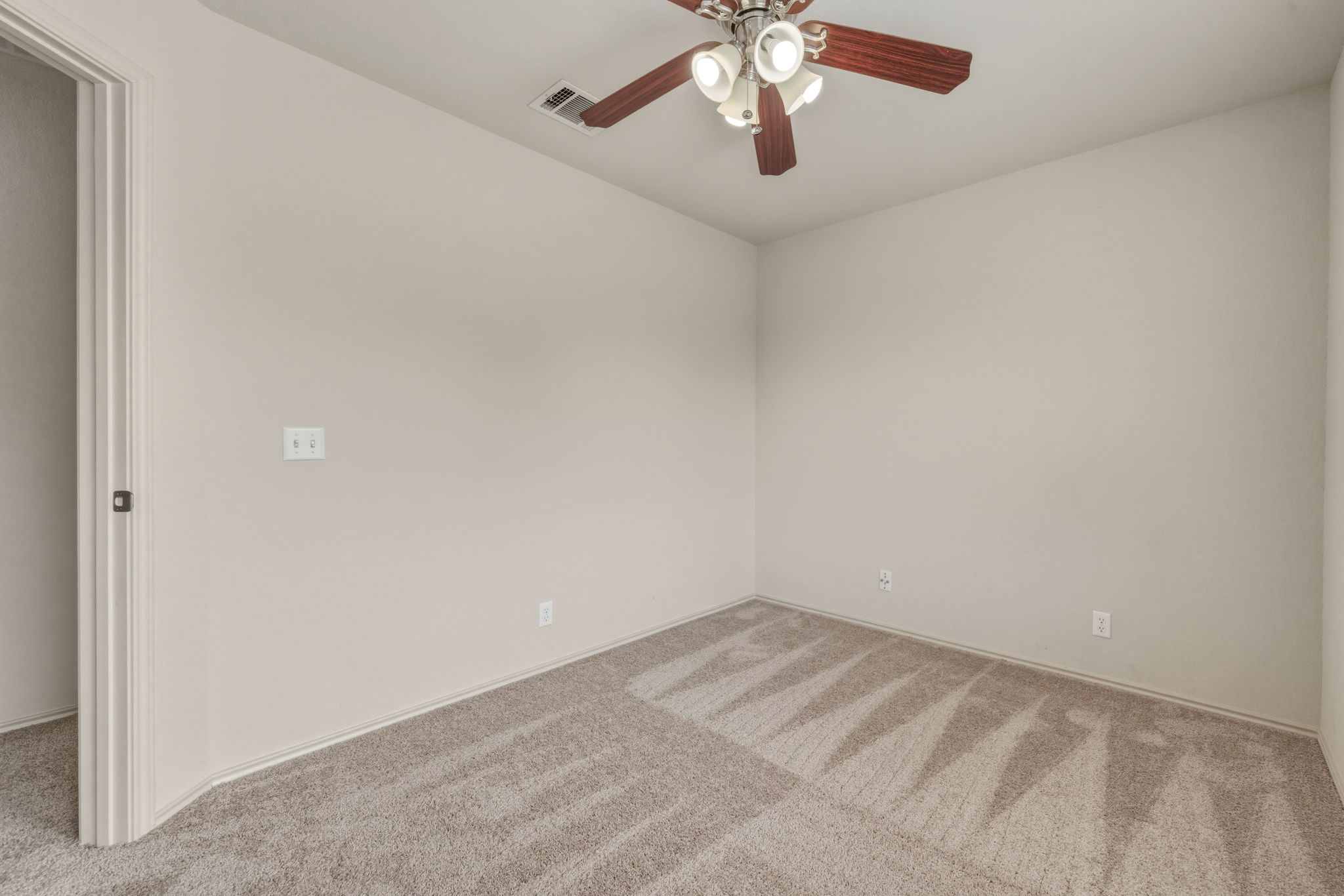 4528 Best Way Austin, TX 78725 - Photo 22 of 40 Spare room with light colored carpet and a ceiling fan