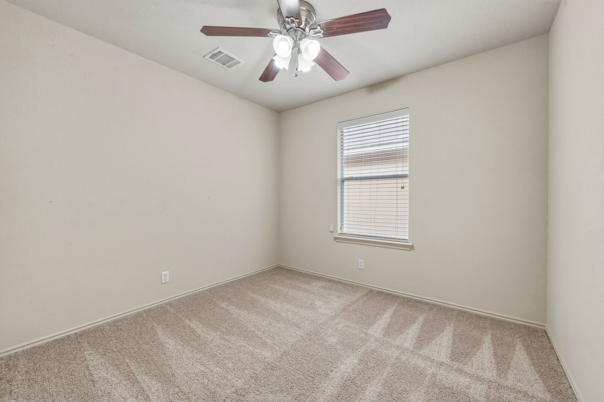 4528 Best Way Austin, TX 78725 - Photo 23 of 40 Unfurnished room with a ceiling fan and light carpet