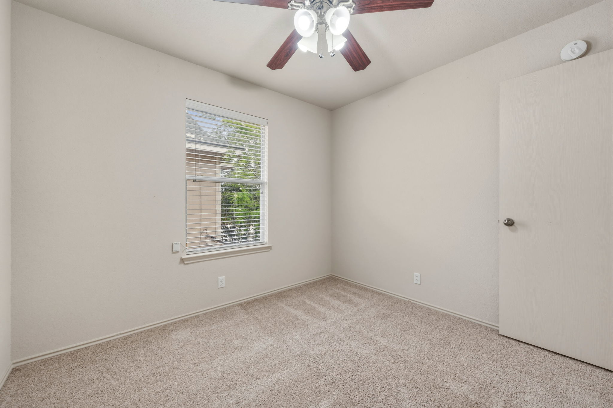 4528 Best Way Austin, TX 78725 - Photo 24 of 40 Unfurnished room featuring light carpet and ceiling fan