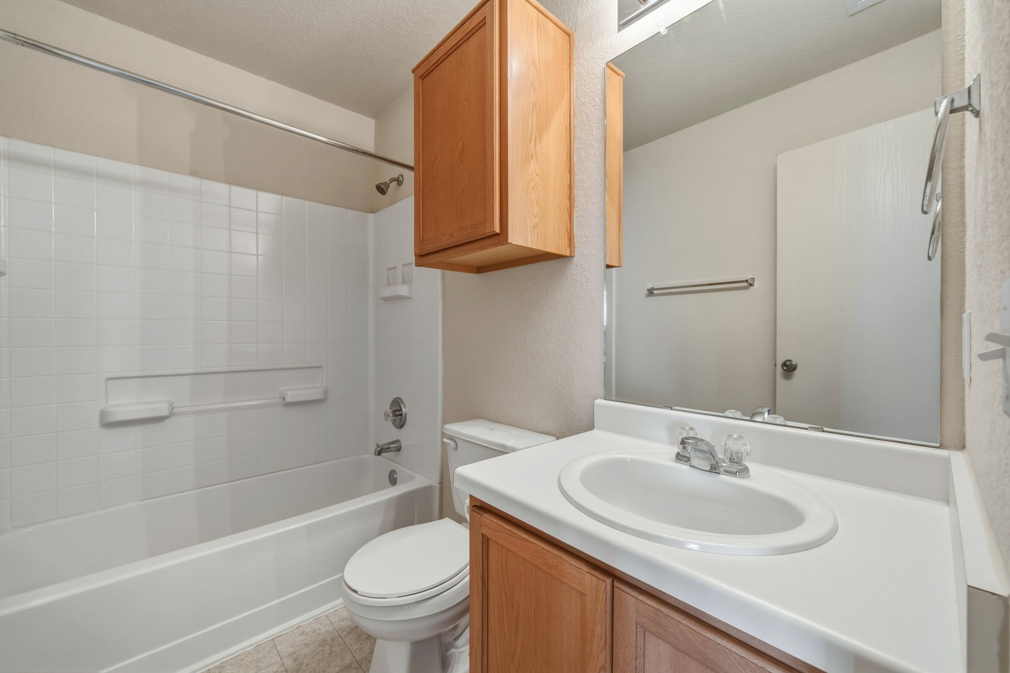 4528 Best Way Austin, TX 78725 - Photo 27 of 40 Bathroom featuring vanity, shower / bathtub combination, and light tile patterned floors