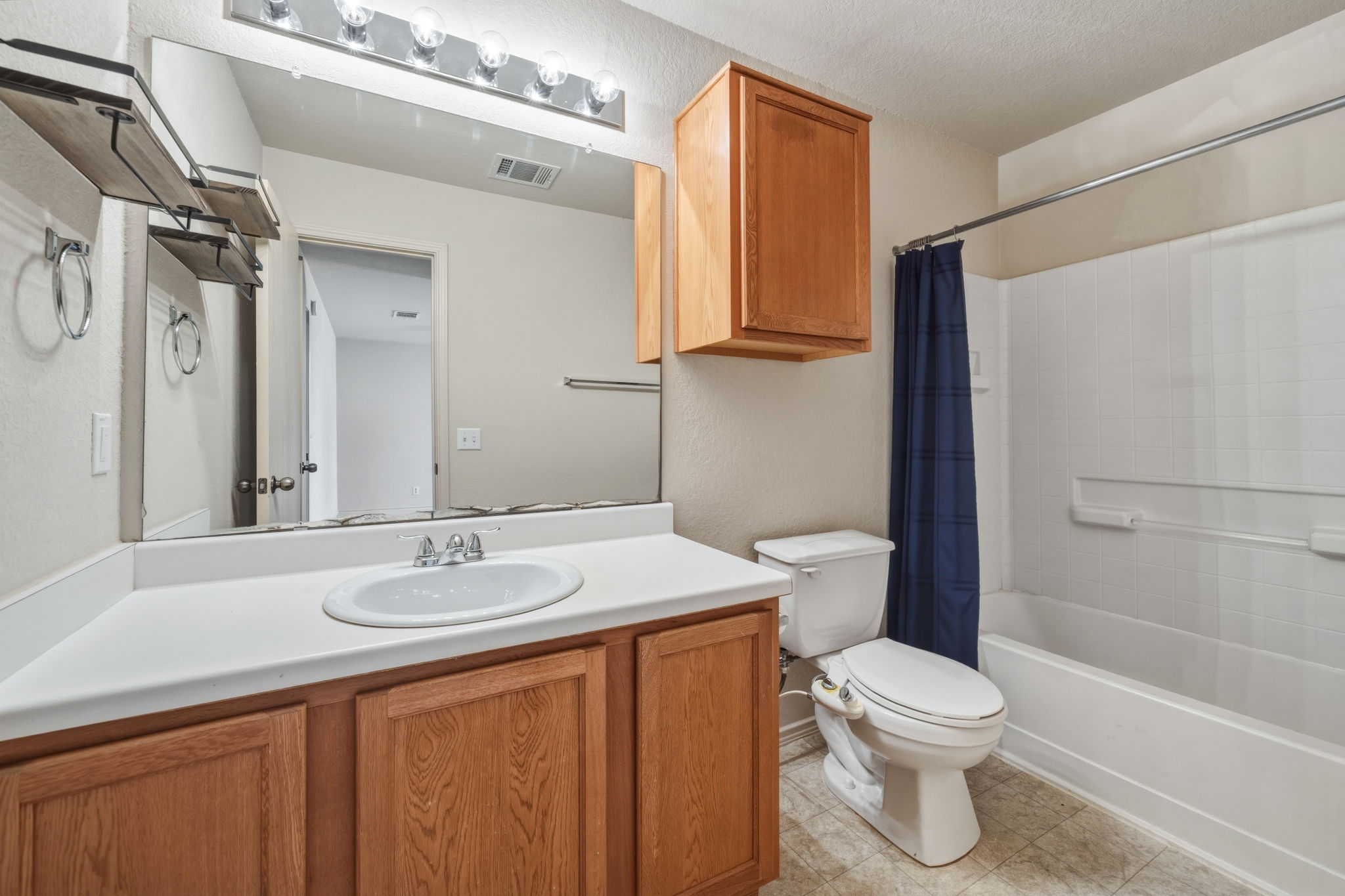 4528 Best Way Austin, TX 78725 - Photo 33 of 40 Bathroom with vanity and shower / bath combination with curtain