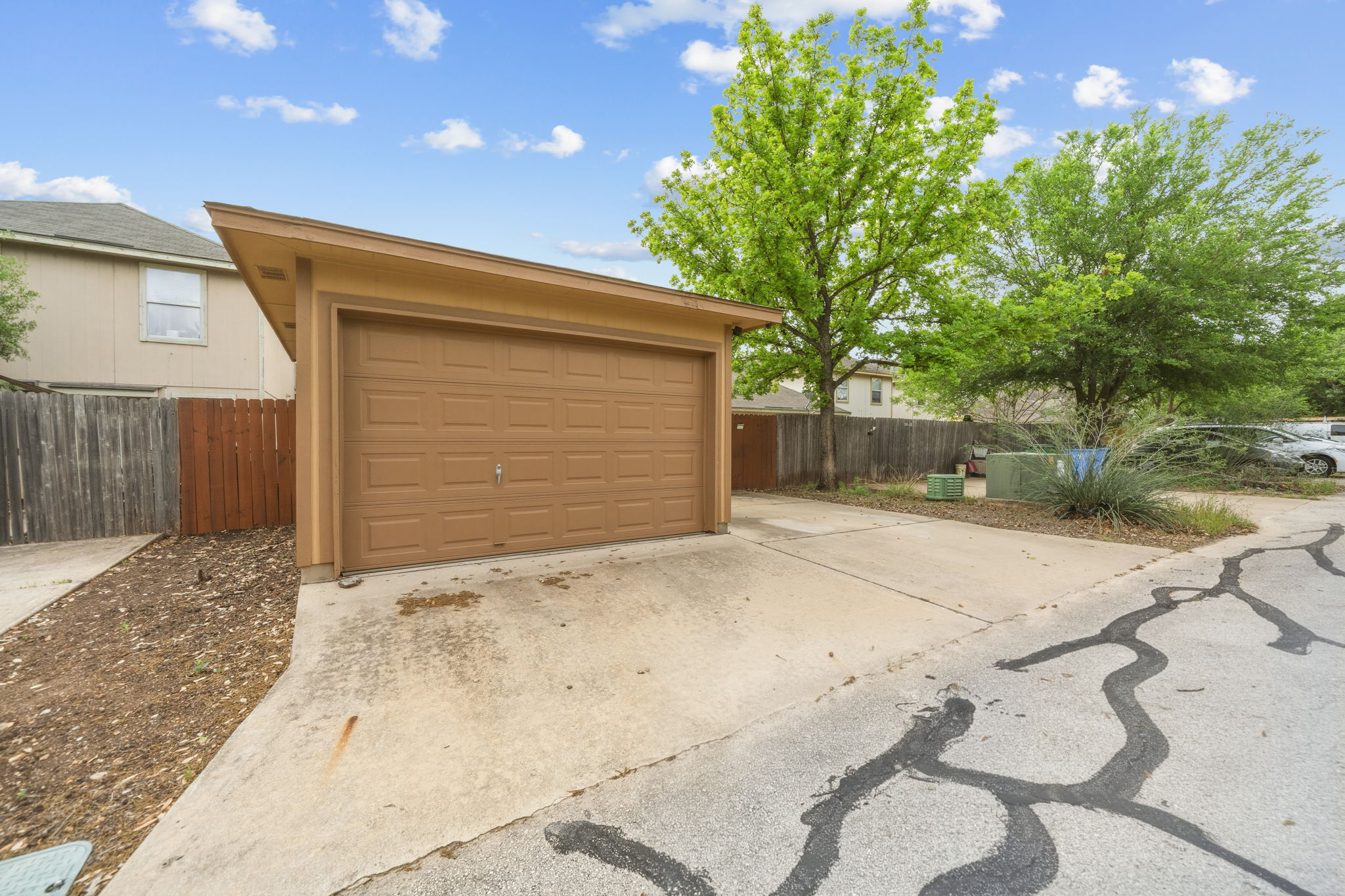 4528 Best Way Austin, TX 78725 - Photo 39 of 40 Detached garage featuring driveway