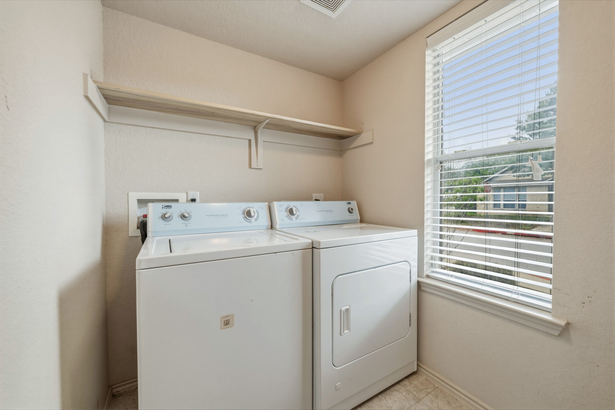 4528 Best Way Austin, TX 78725 - Photo 5 of 40 Laundry room featuring washing machine and dryer and baseboards