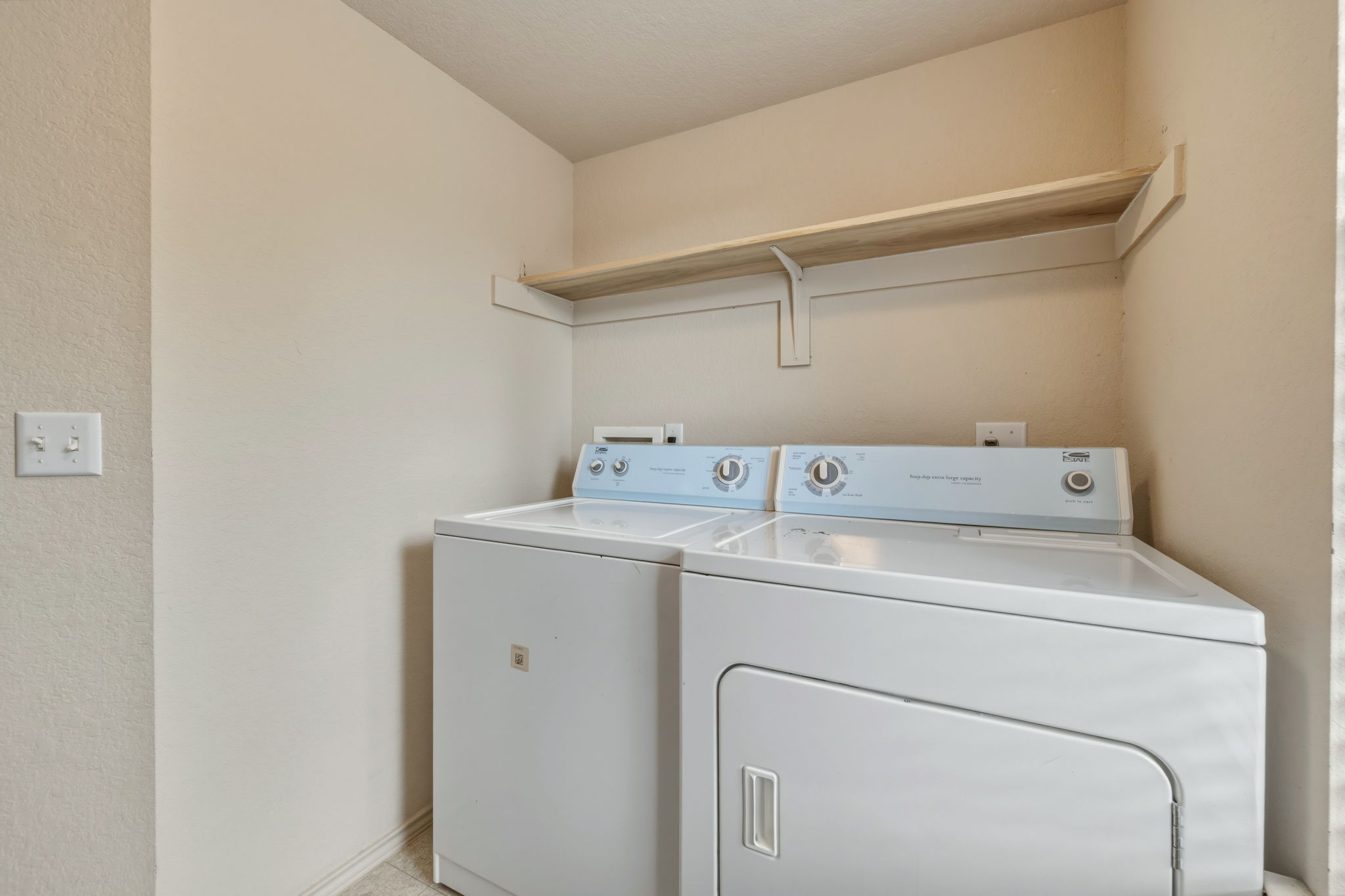 4528 Best Way Austin, TX 78725 - Photo 6 of 40 Laundry room featuring washing machine and clothes dryer and baseboards