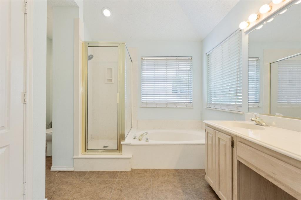 4709 Portrait Lane Plano, TX 75024 - Photo 17 of 22 The Primary Bathroom features jetted tub, seperate shower and abundant natural light.