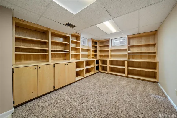 a view of an empty room with empty shelves