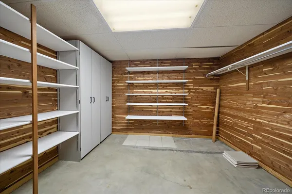 a view of an empty room with racks on the wall