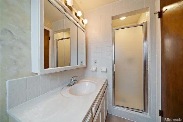 a bathroom with a sink and a large mirror