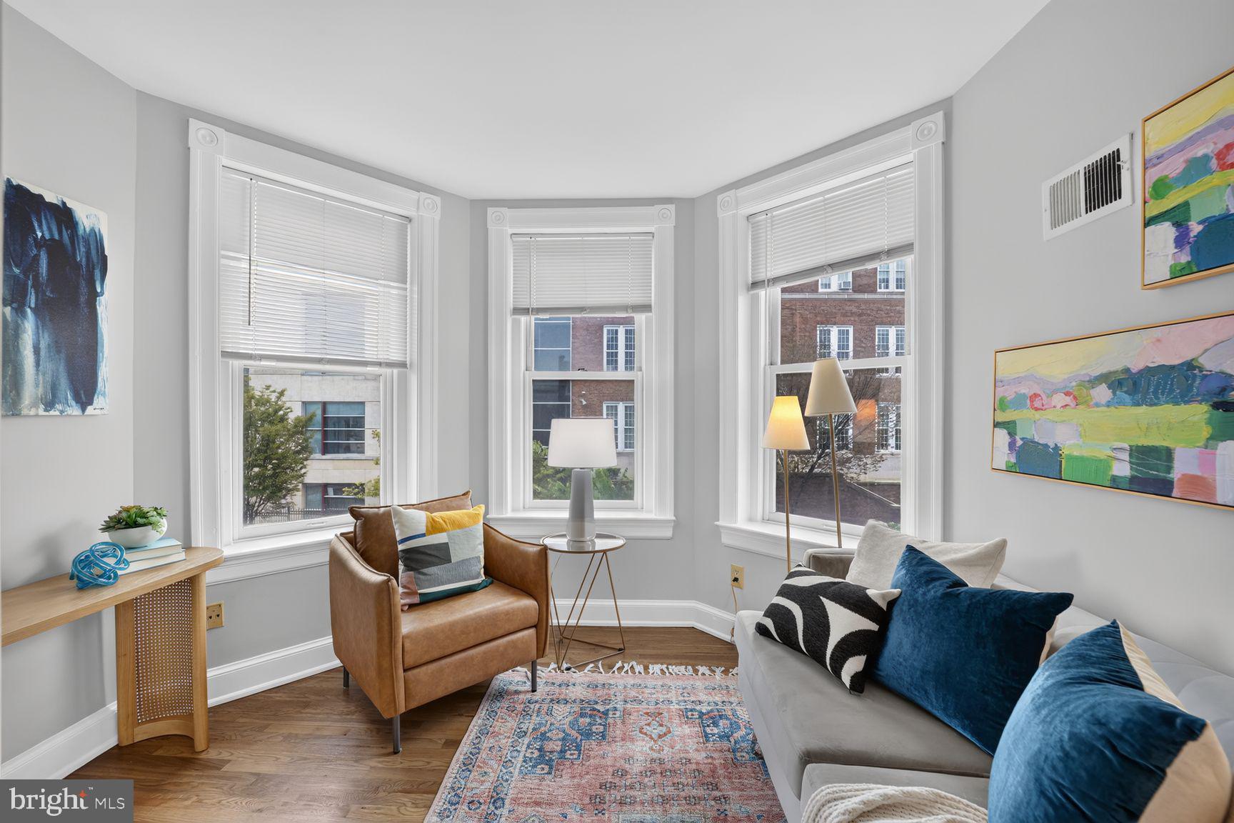 516 4th Street Northeast, Unit 202 Washington, DC 20002 - Photo 4 of 18 Light-filled living room w/a bay window