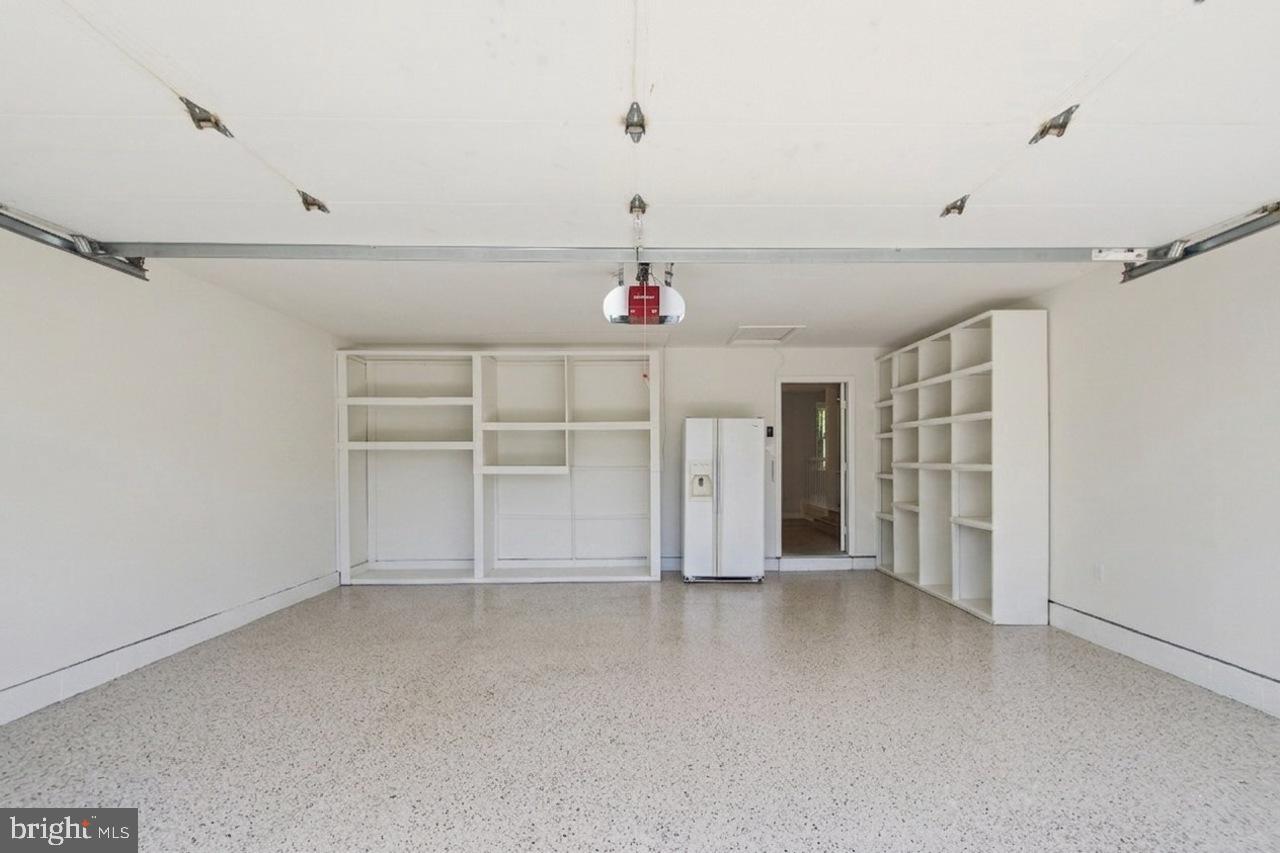 7100 Counter Place Burke, VA 22015 - Photo 42 of 54 Oversized 2 car garage, new Apoxy Floor, storage