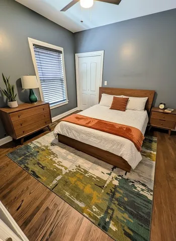 a bedroom with bed and window