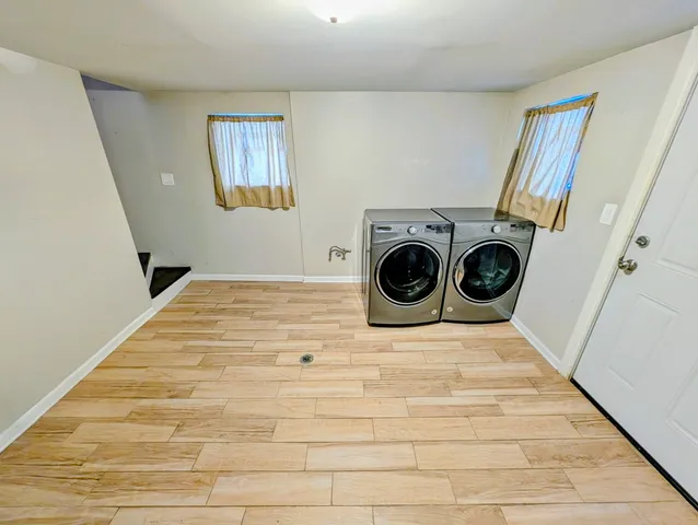 a view of a hallway with washer and dryer